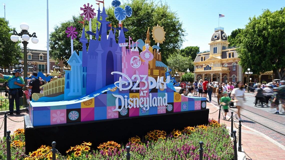 The D23 Day at Disneyland Resort decorative sign with castle sculptures