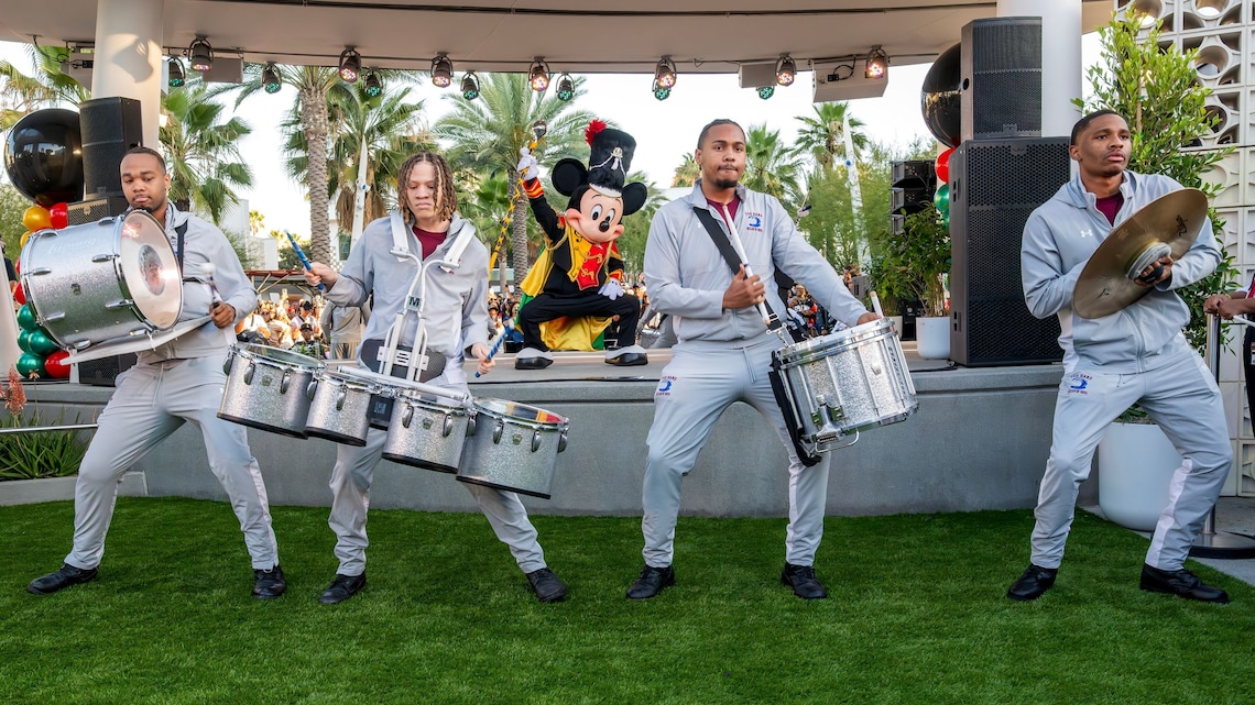 Drum Major Mickey Mouse performs on stage with members of the Texas Southern University Ocean of Soul drumline