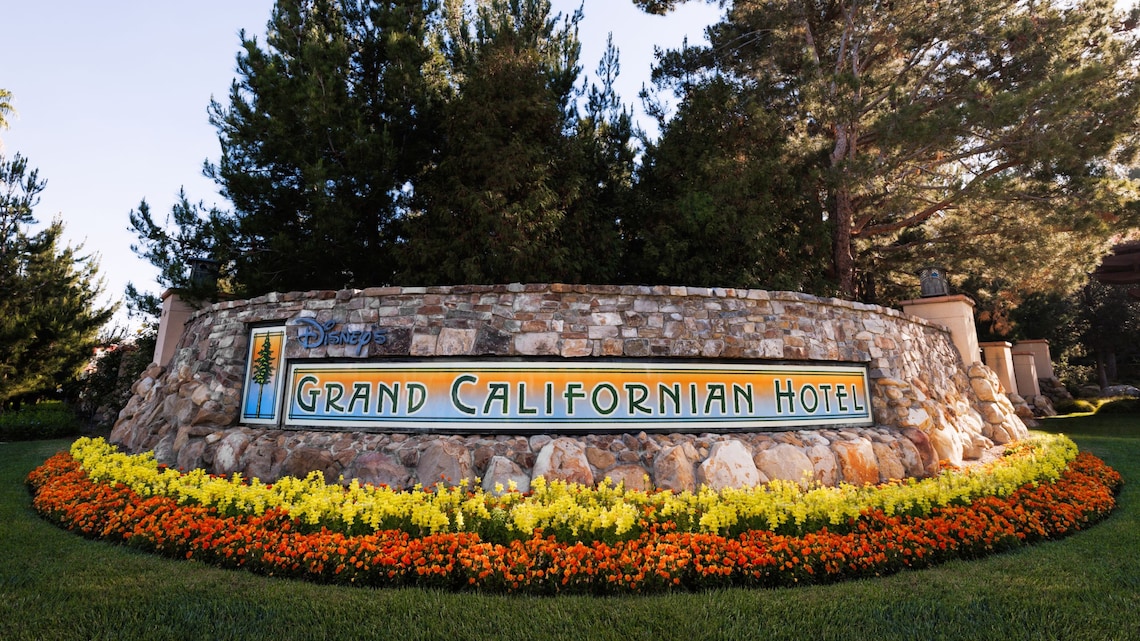 An outdoor sign reads Disney’s Grand Californian Hotel
