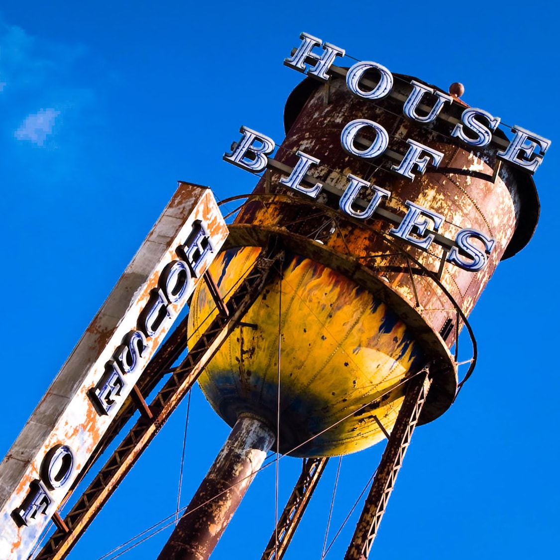 View skyward of the House of Blues sign