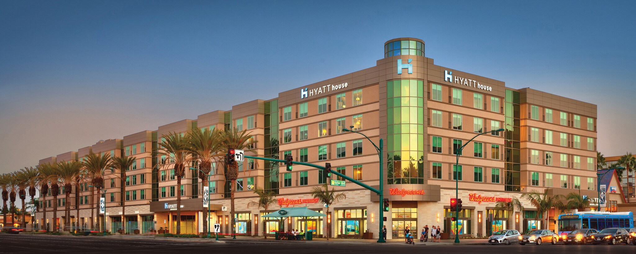 Palm trees line the sidewalks outside the Hyatt House hotel in Anaheim, California