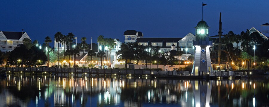 Panoramic view of Crescent Lake at Disney's Yacht Club Resort, lit up at night
