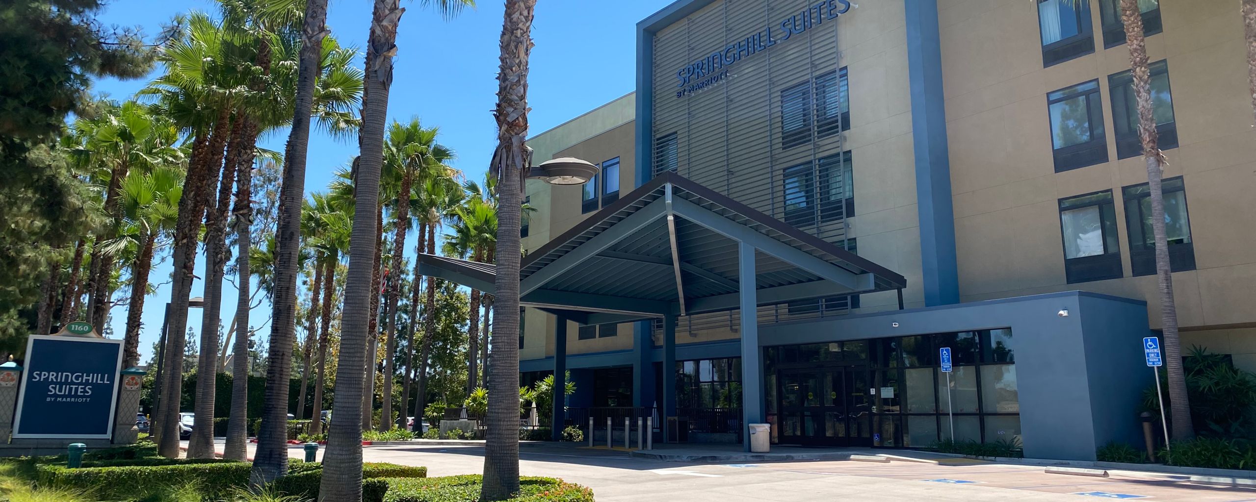 With palm trees lining the entrance, the modern style Springhill Suites by Marriott Anaheim Maingate.