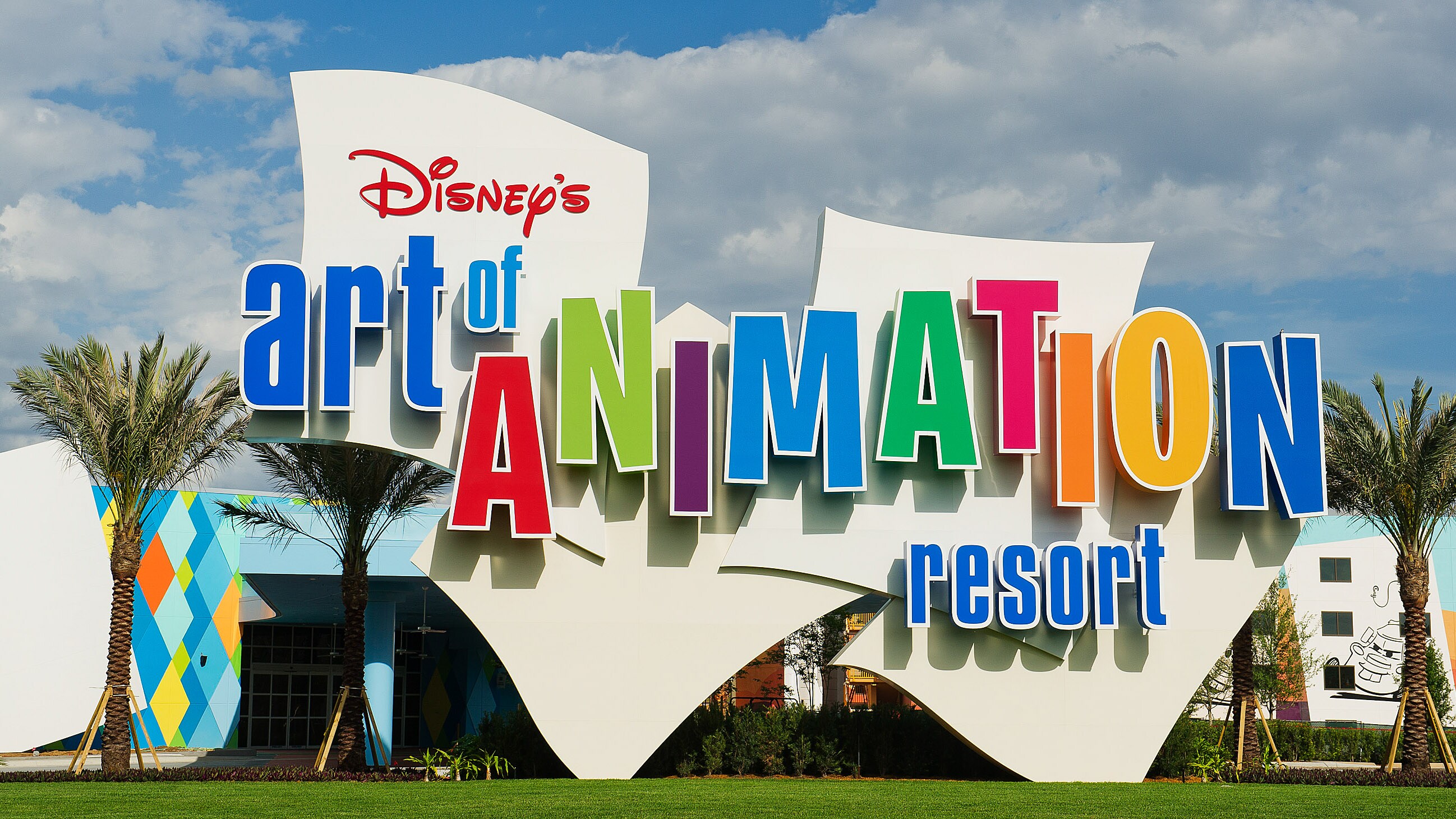 The colorful logo and building exterior of Disney's Art of Animation Resort