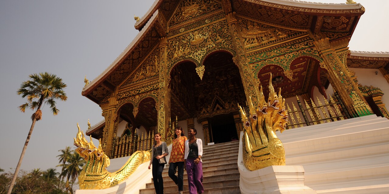 3 teenage girls walk down the steps of an ornate building 3 teenage girls walk down the steps of an ornate building