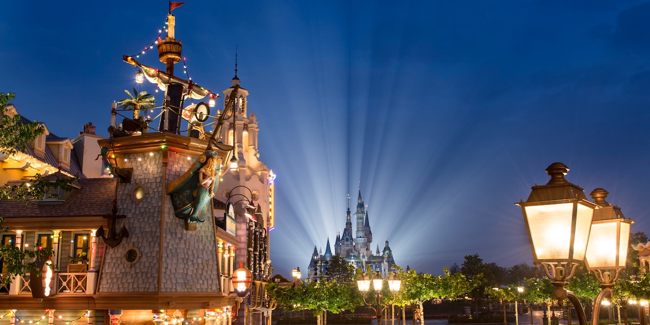 Treasure Cove and Enchanted Storybook Castle are lit up at night at Shanghai Disneyland Treasure Cove and Enchanted Storybook Castle are lit up at night at Shanghai Disneyland