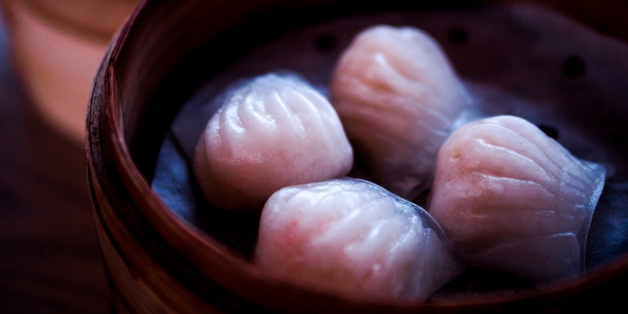 Four dumplings in a bamboo steamer Four dumplings in a bamboo steamer