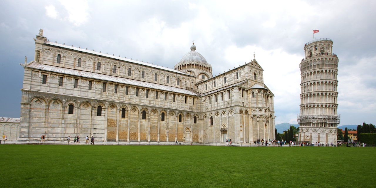 The Pisa Cathedral with its domed top and the Leaning Tower of Pisa beside it in Cathedral Square The Pisa Cathedral with its domed top and the Leaning Tower of Pisa beside it in Cathedral Square