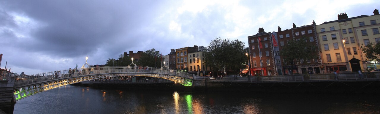 A river and small bridge in an old European city A river and small bridge in an old European city