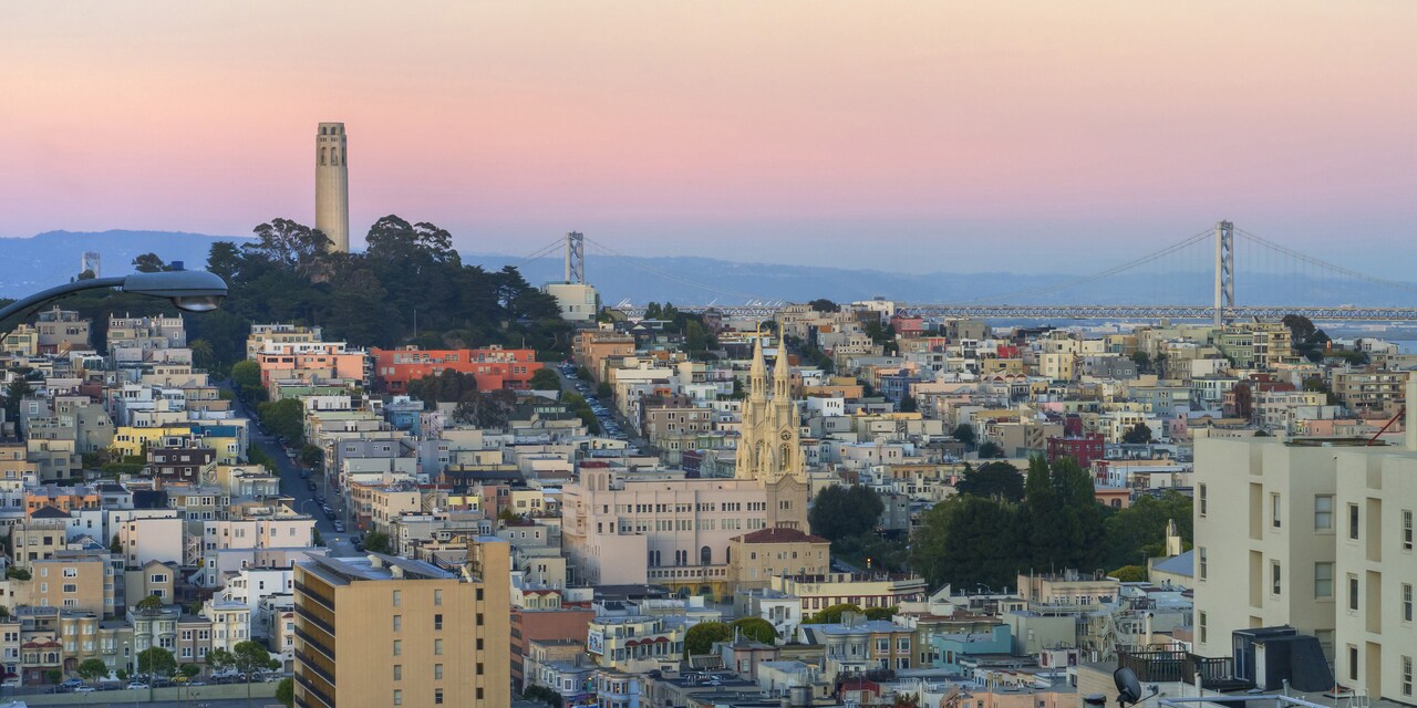 San Francisco at dusk, featuring the Coit Tower and Bay Bridge San Francisco at dusk, featuring the Coit Tower and Bay Bridge