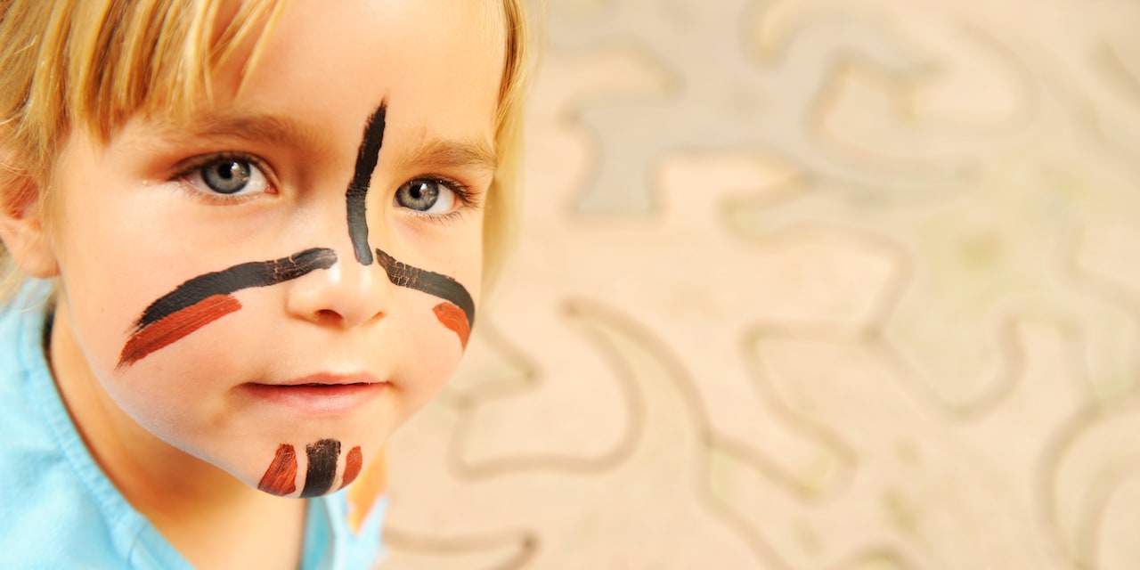 A little boy with a painted face A little boy with a painted face