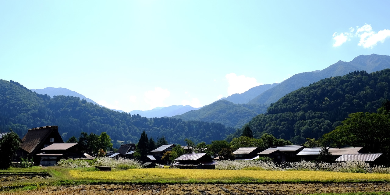 Structures of Shirakawa-go village nestled in the tree-covered mountains