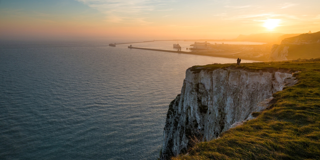 A cliff overlooking the sea at sunset A cliff overlooking the sea at sunset