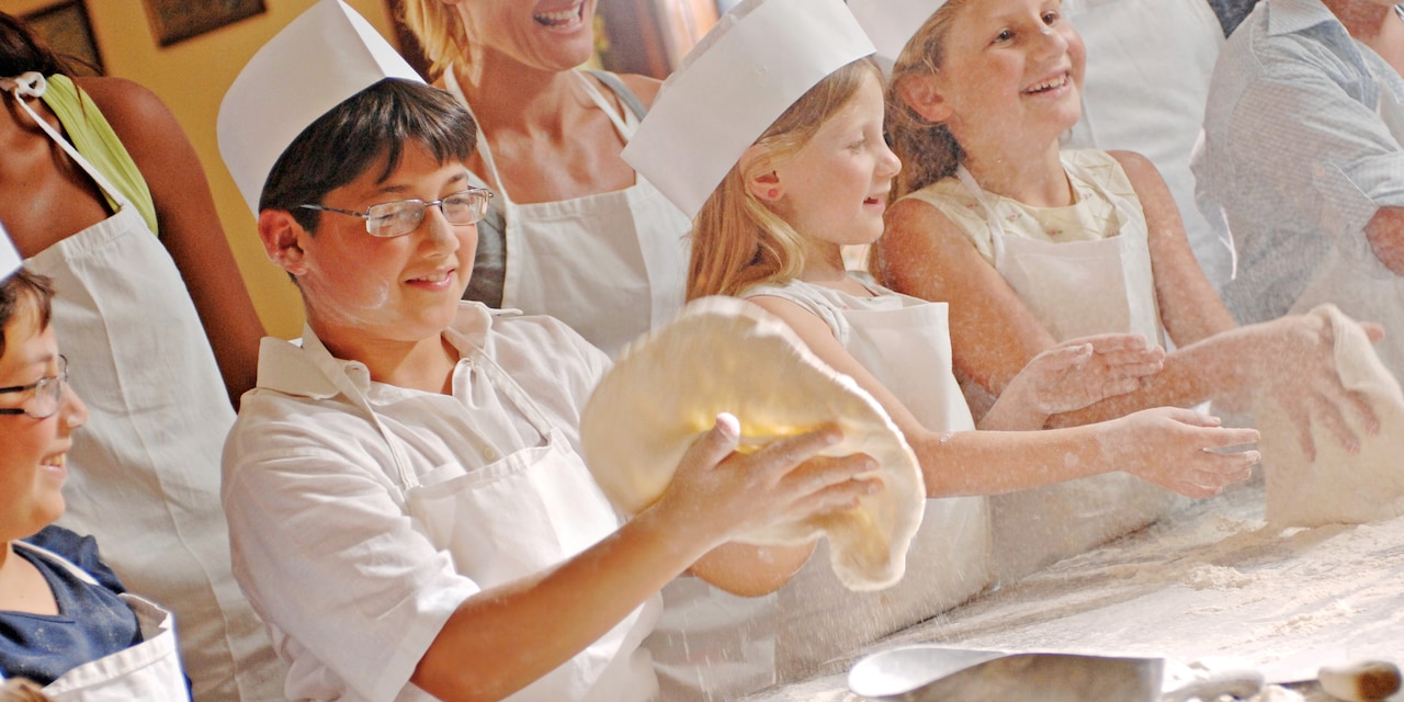 Children learning how to make a pizza crust Children learning how to make a pizza crust