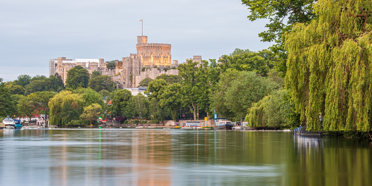 Lush foliage and the River Thames surround Windsor Castle