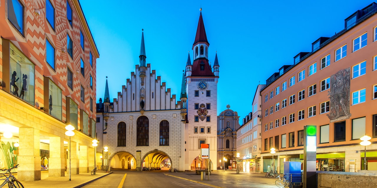 A street-level view of the largest public square in Munich featuring the spired Old Town Hall