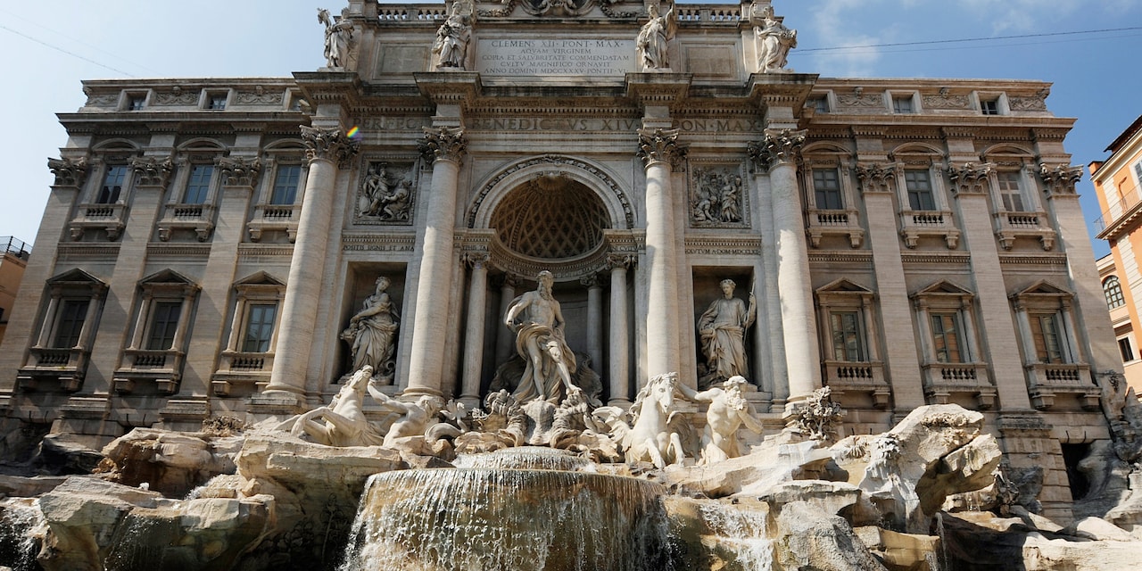 The Trevi Fountain adorned with beautiful statues in Rome, Italy The Trevi Fountain adorned with beautiful statues in Rome, Italy