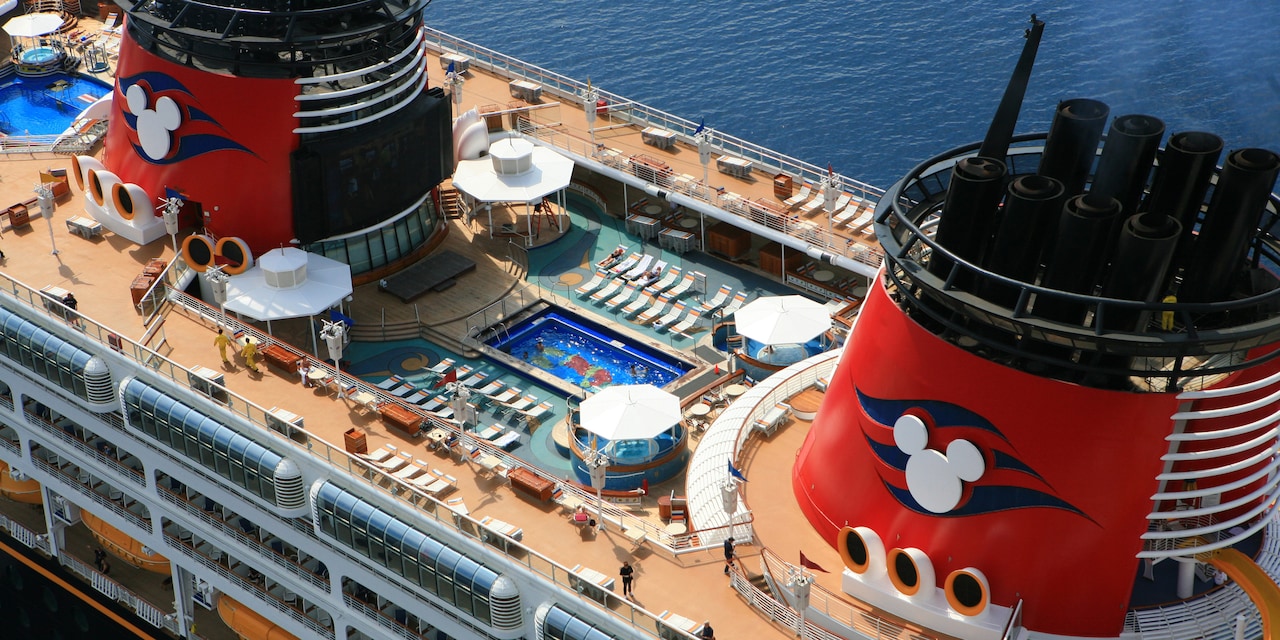 The upper deck and swimming pool of the Disney Magic Cruise Ship The upper deck and swimming pool of the Disney Magic Cruise Ship