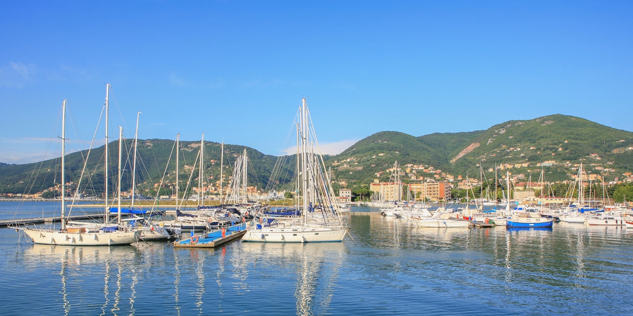 Sailboats docked in a harbor Sailboats docked in a harbor