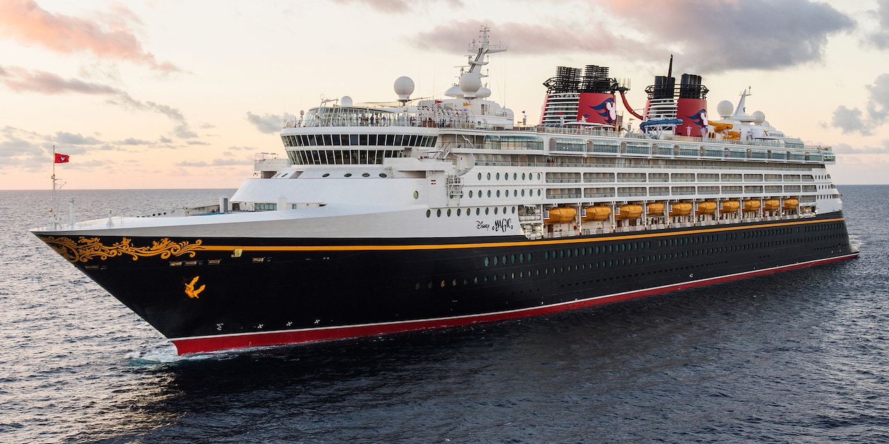 The Disney Magic Cruise Ship cruises along calm waters The Disney Magic Cruise Ship cruises along calm waters
