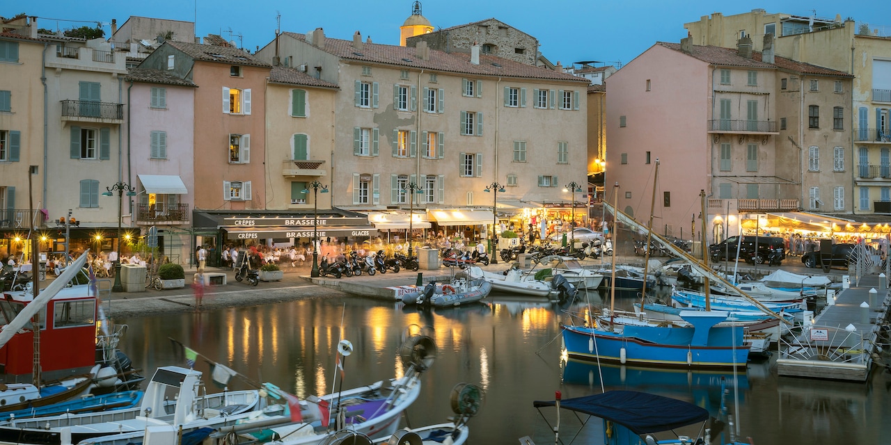 Boats fill the dock slips at a Saint-Tropez harbor in the evening Boats fill the dock slips at a Saint-Tropez harbor in the evening