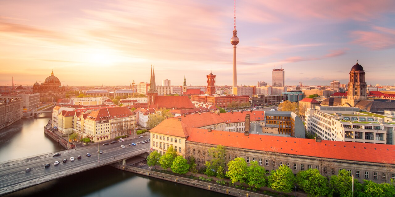 The city of Berlin in Germany featuring the Spree River and tall buildings along the harbor