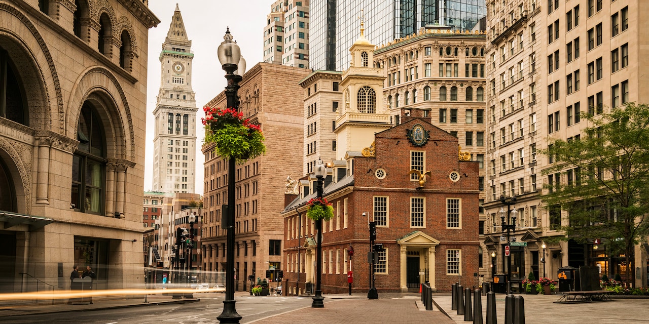 The Old State House in Boston’s North End surrounded by tall buildings The Old State House in Boston’s North End surrounded by tall buildings