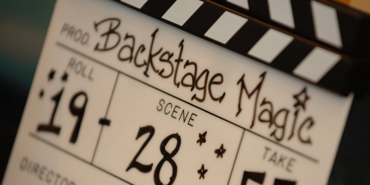 A film slate reading 'Backstage Magic' and giving numbers for 'Roll,' 'Scene,' and 'Take' A film slate reading 'Backstage Magic' and giving numbers for 'Roll,' 'Scene,' and 'Take'