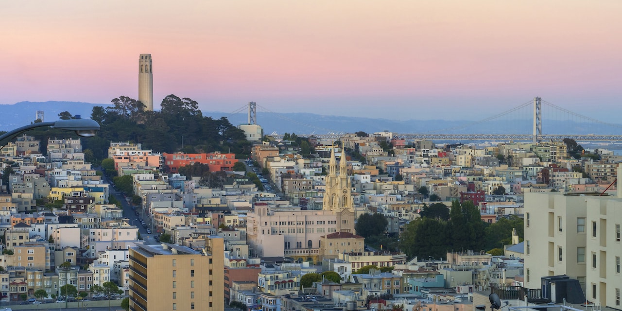 San Francisco at dusk, featuring the Coit Tower and Bay Bridge San Francisco at dusk, featuring the Coit Tower and Bay Bridge