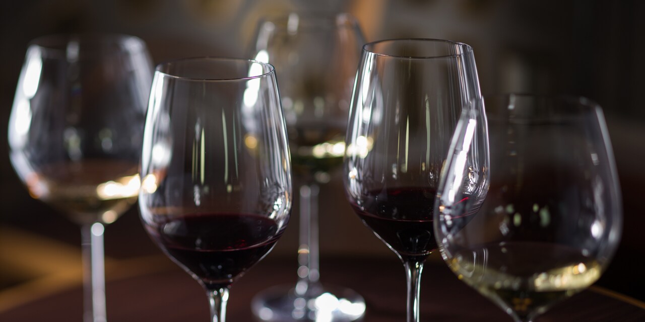 Five wine glasses containing assorted wines Five wine glasses containing assorted wines