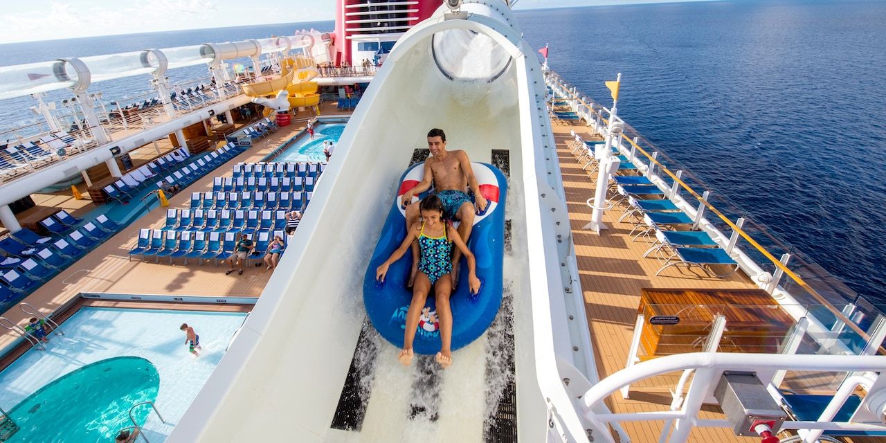 Two Guests ride a boat down the AquaDuck water coaster on the Disney Fantasy cruise ship Two Guests ride a boat down the AquaDuck water coaster on the Disney Fantasy cruise ship