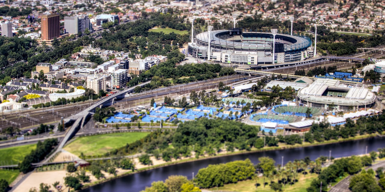 An aerial view of the city of Melbourne with the Melbourne Cricket Ground in the foreground