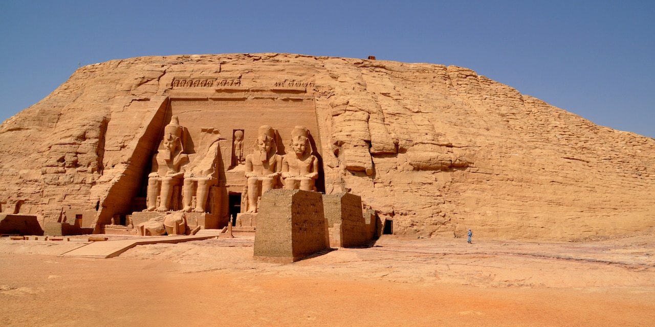 The large Egyptian sculptures carved into the side of a rock at the entrance to a temple in Abu Simbel, Egypt 