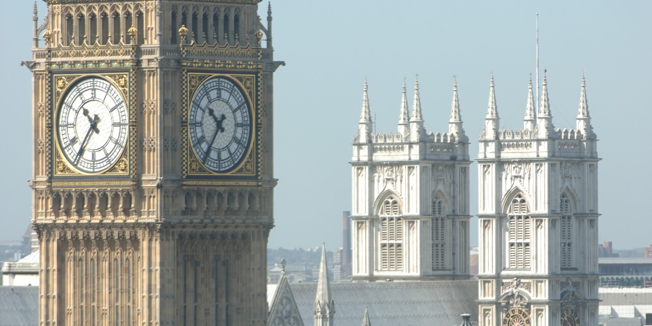 The tower clock, Big Ben, with Westminster Abbey in the background