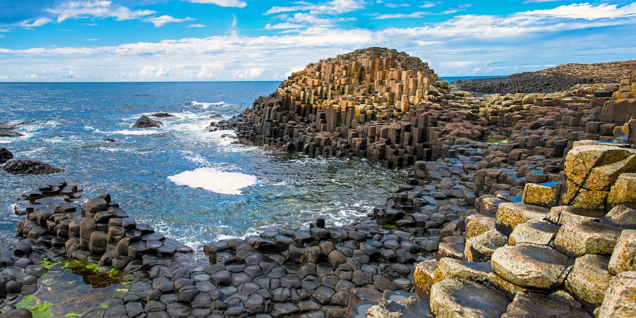 A large cluster of rocky columns in the sea off Northern Ireland’s Antrim Coast 