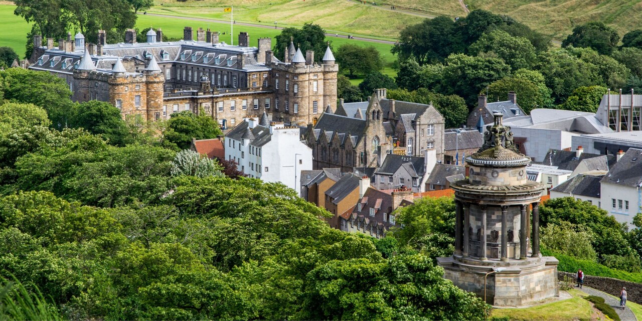 Holyroodhouse Castle near buildings at the end of the Royal Mile in Edinbugh, Scotland