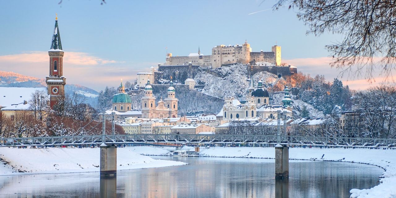 The Danube River flows by snowy Salzburg, Austria