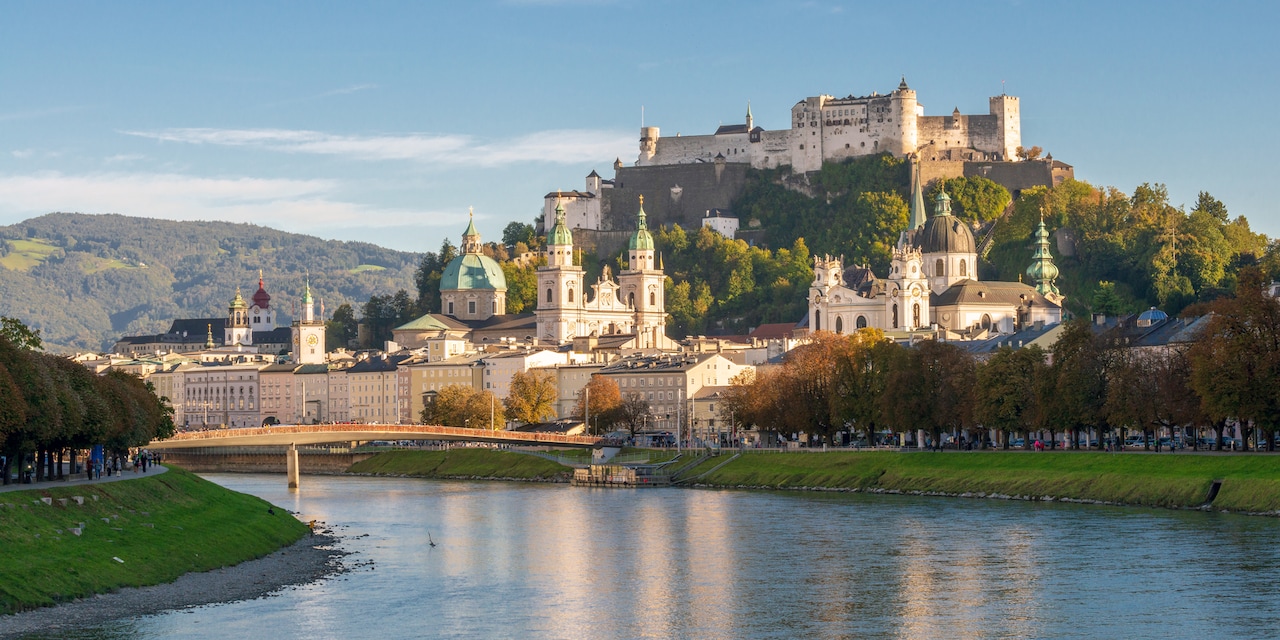 Salzburg and a castle on a hill overlook the Danube River