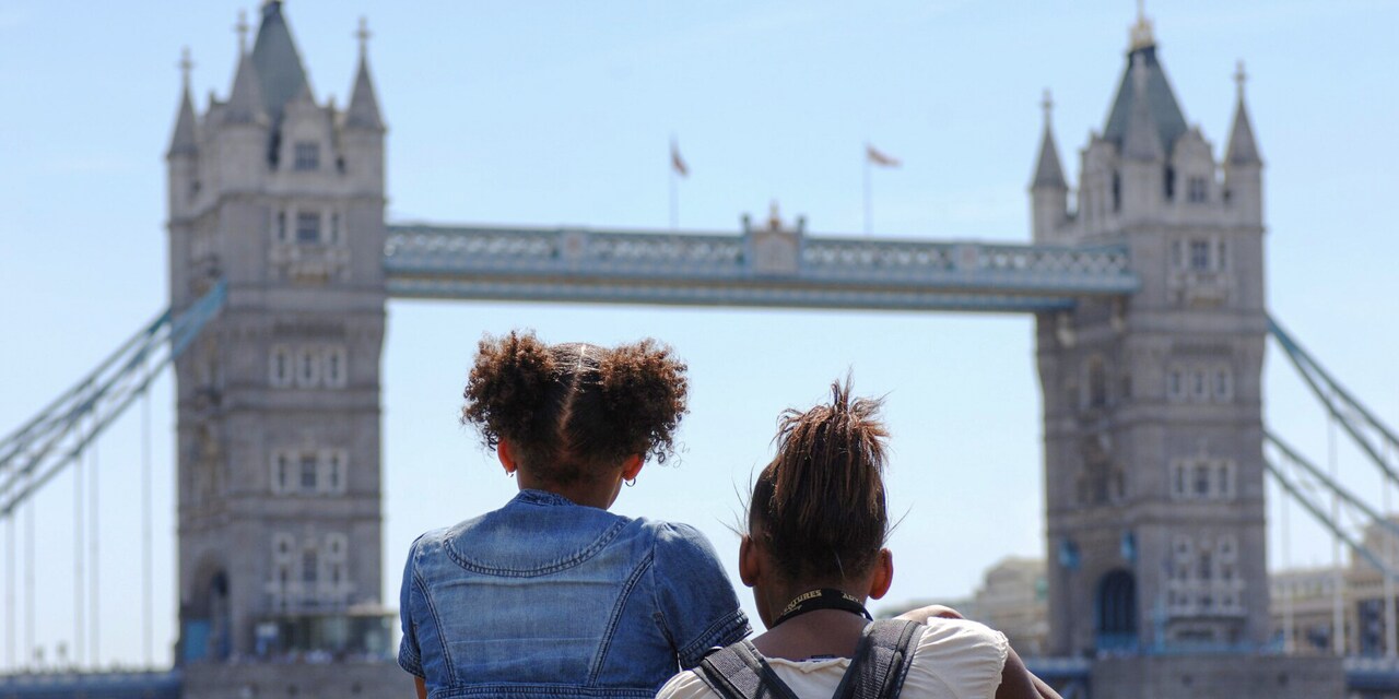 Two girls looking at Tower Bridge