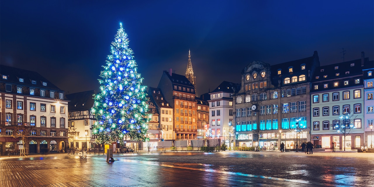 A large Christmas tree lit up in a Strasbourg, France town square