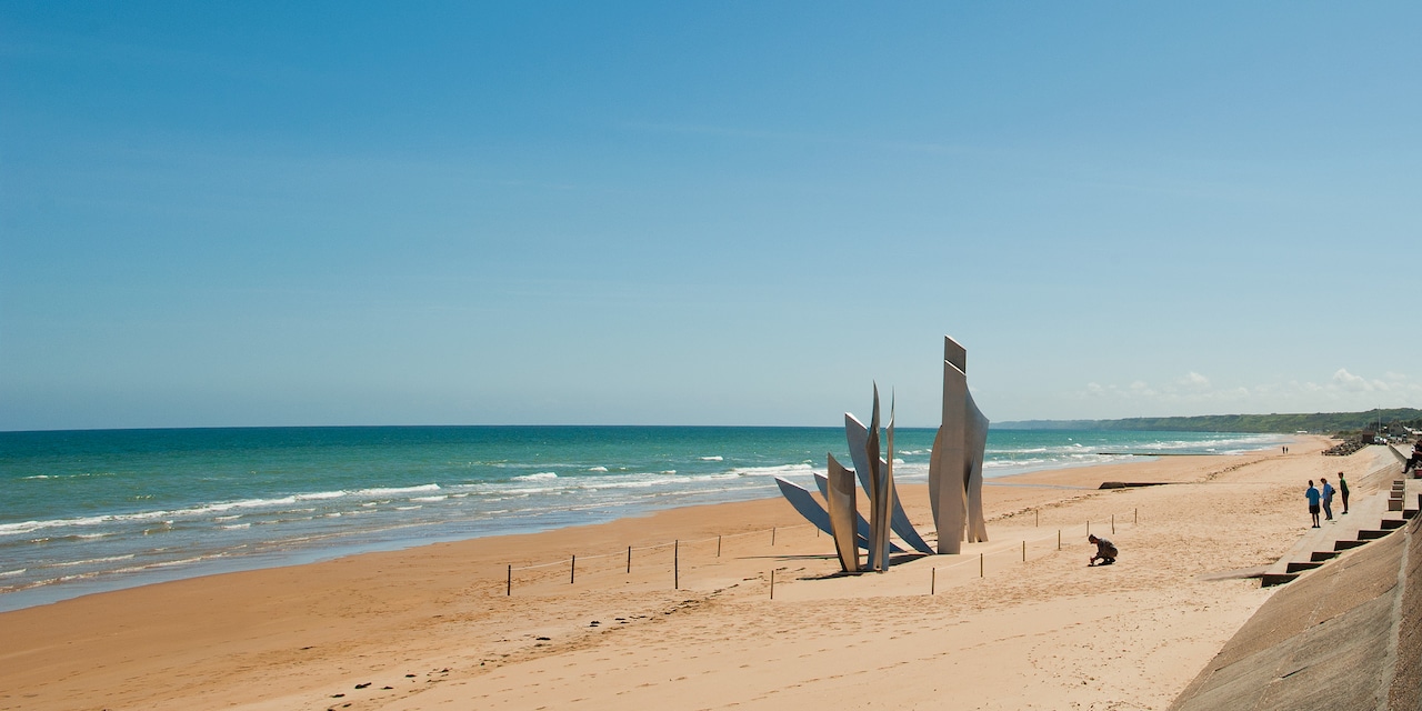 Flags of many nations fly near Les Braves Memorial of Omaha Beach in Normandy, France