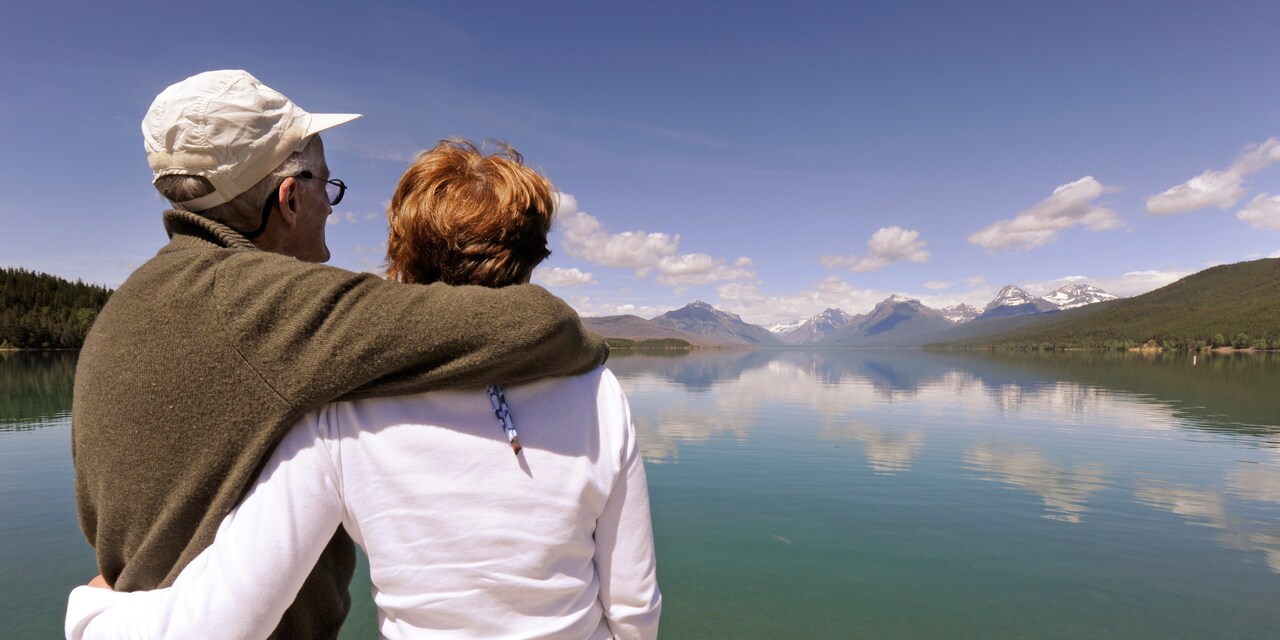 A couple takes in beautiful lake and mountain views