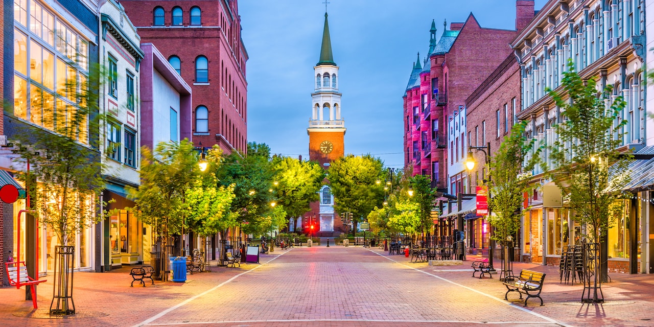 A shop-lined brick road in Burlington, Vermont dead ends at a church with a tall steeple