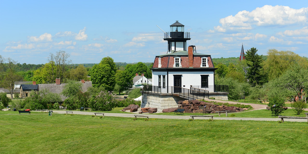 The Colchester Reef Lighthouse on the lush, grassy grounds of the Shelburne Museum