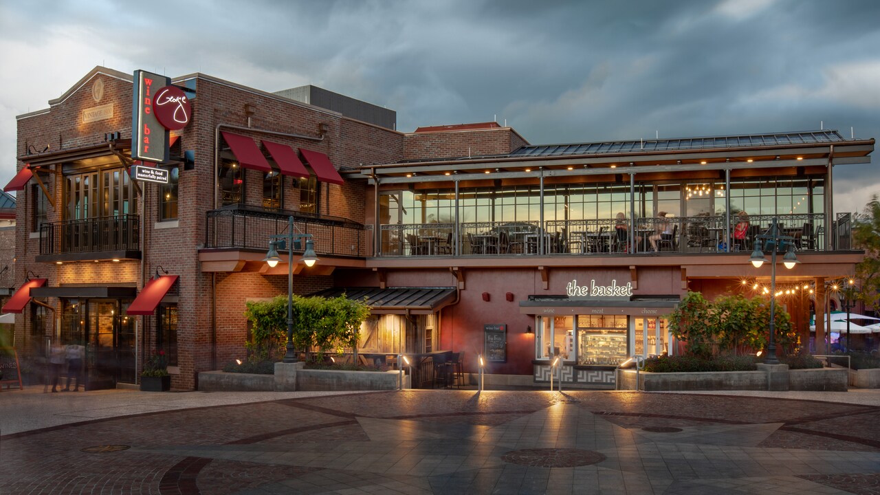 The exterior of Wine Bar George features balcony seating