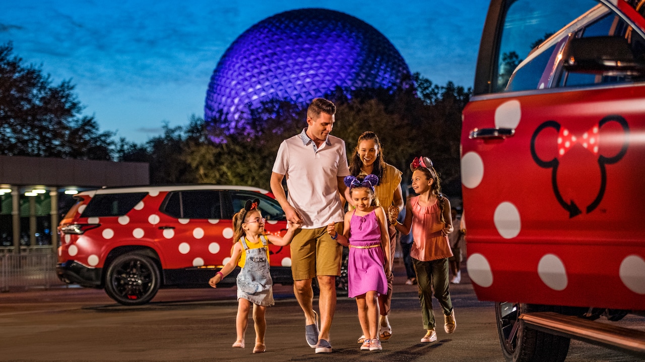 A family arrives at Epcot, leaving behind their Minnie Van service vehicle