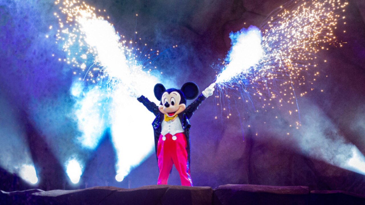 Sparks flying out of Mickey Mouse’s hands