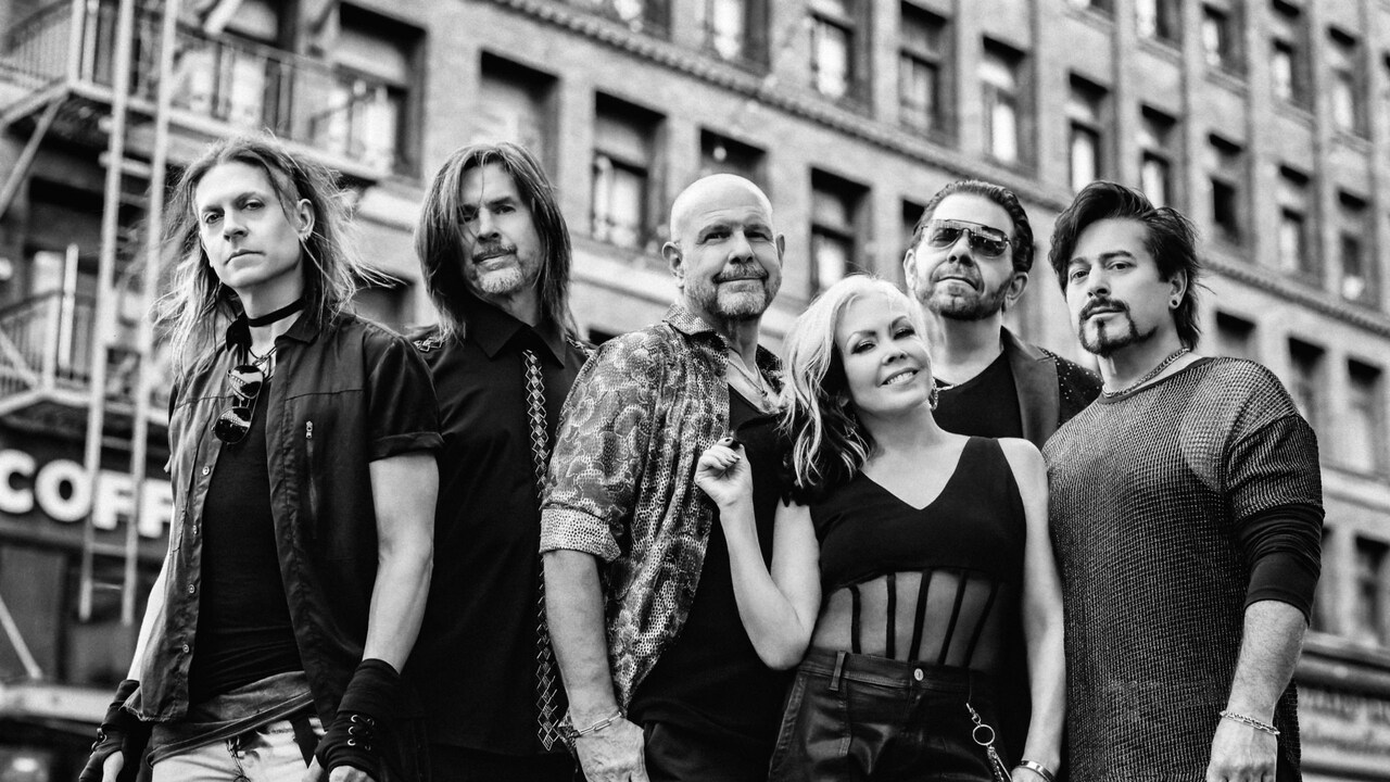 6 members of the group Berlin standing together on a city street