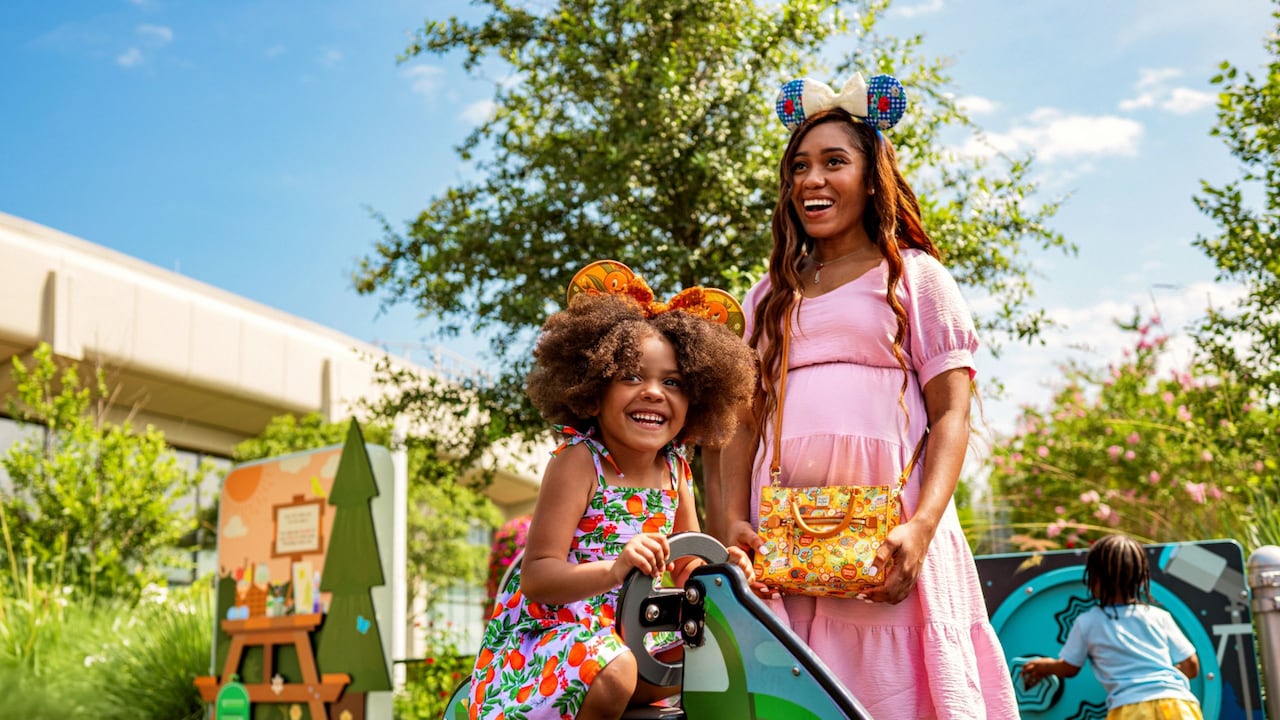A mother and daughter enjoying a play zone during the Epcot International Flower and Garden Festival