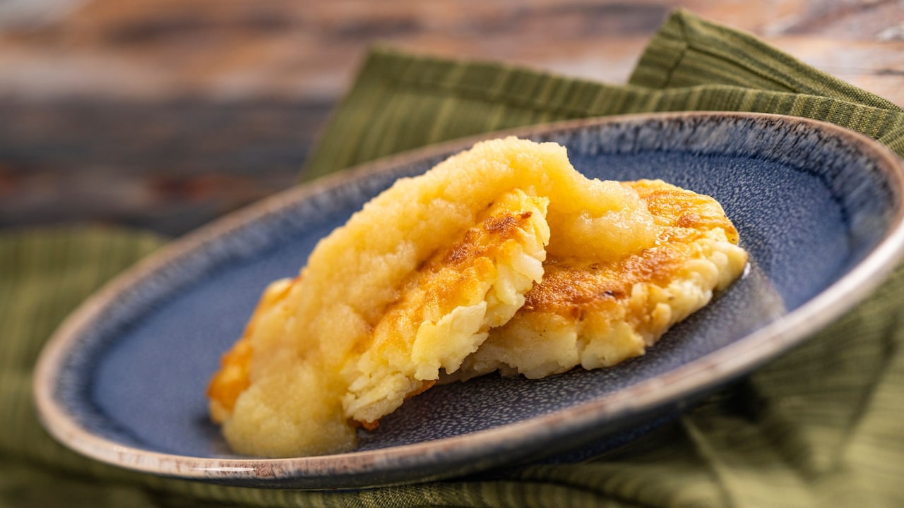 A plate with 2 Potato Pancakes from the Germany stand at the Epcot International Flower & Garden Festival